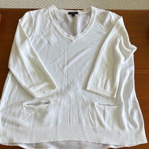 Women's White very elegant dress shirt. Two front pockets. Only used 2 times.